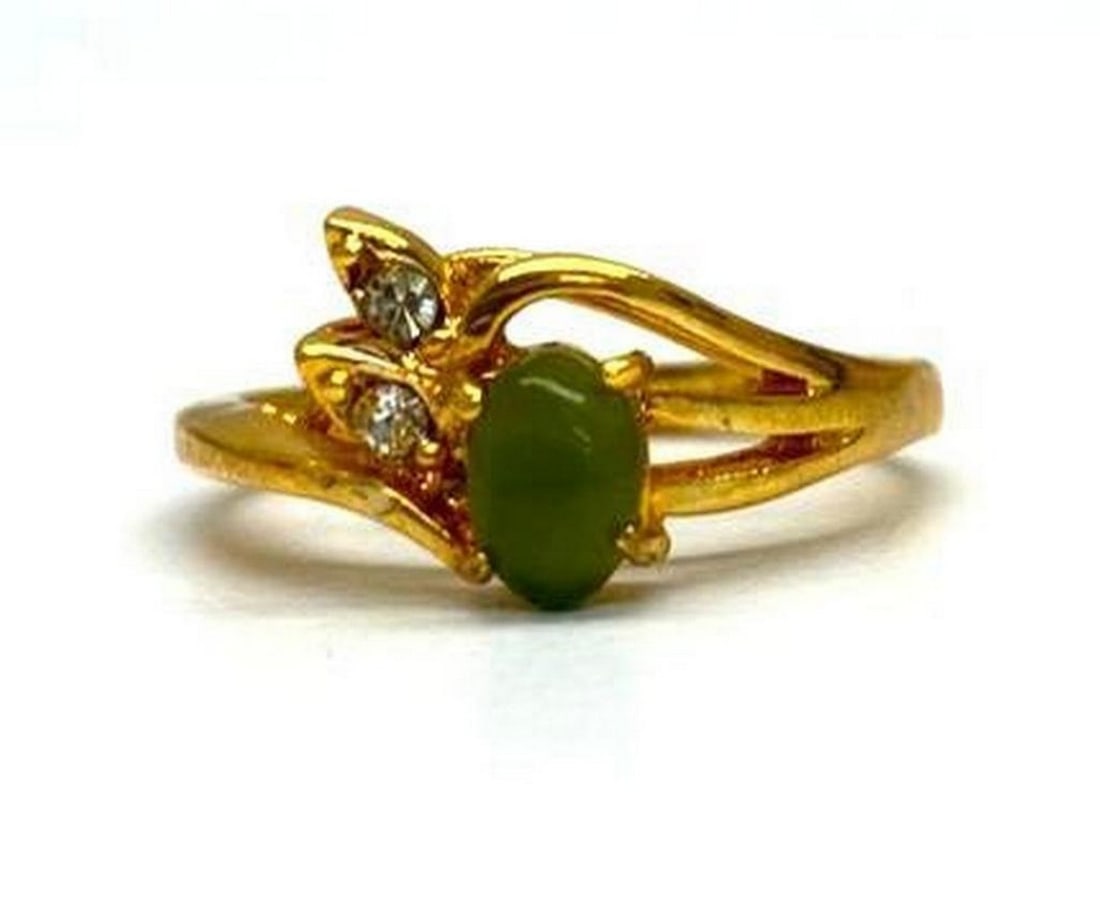 Austrian Crystal-Accented Jade Elegance Ring Size 7: Austrian Crystal-Accented Jade Elegance Ring Size 7 Distinctive and unique green Jade stone surrounded by Austrian crystals on a 18KTGP Band.Green Jade is believed to improve kidney and heart function
