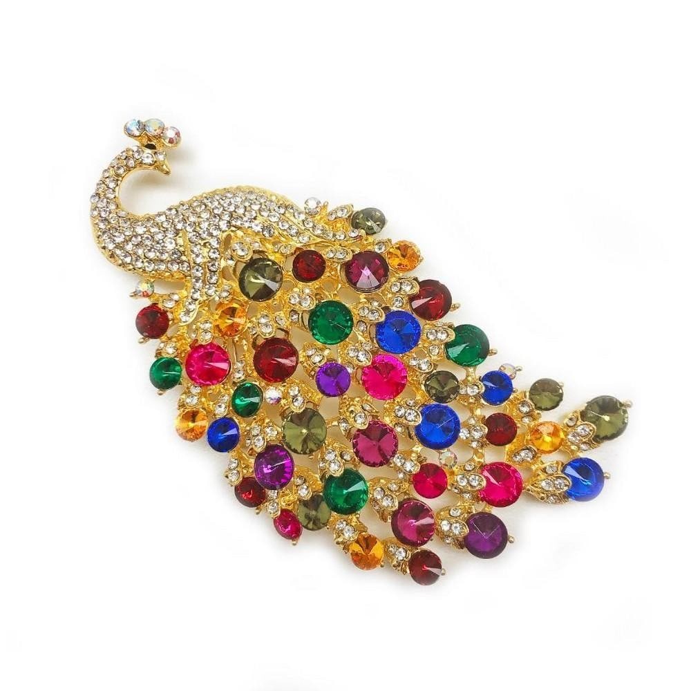 LARGE ROYAL MULTI-COLOR JEWEL PEACOCK BROACH: Large Royal Multi-Color Jewel Peacock Broach. That Has Over 75+ Glimmering Crystals. The Broach Is Supported By A Safety Lock Pin On The Back. Height: 6cm View Photos For Further Details.