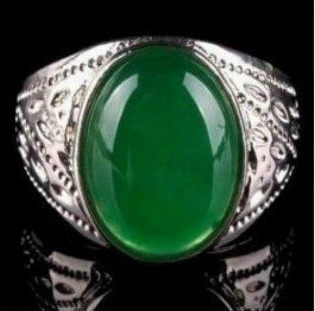 Tibetan Silver Ring Accented With Emerald Green Jade Gemstone: Tibetan Silver Ring Accented With Emerald Green Jade Gemstone The Green Jade gemstone brings calm, peace and serenity. It harmonizes and balances internally. It is a gemstone which protects from harm
