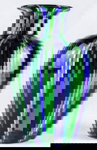 Blue and Green Cannes Filigree Murano Glass Vase: Blue and Green Cannes Filigree Murano Glass Vase Inspired by the elegance of the French Riviera, this vase is a striking display of Murano glass mastery. Featuring delicate vertical filigree stripes