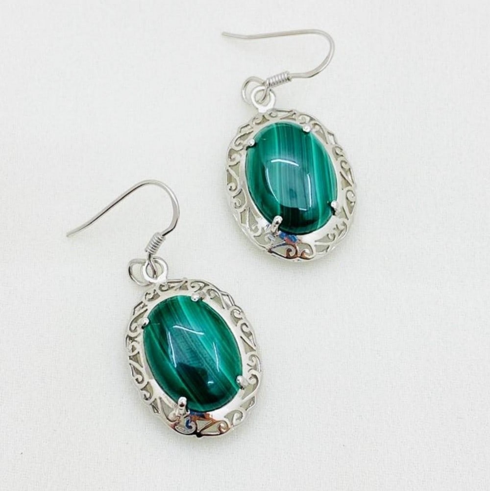 Malachite Cabochon Wire Back Earrings: Malachite Cabochon Wire Back Earrings Introducing our exquisite 925 Sterling Silver Earrings, meticulously crafted to showcase a unique design enveloping a mesmerizing greenish malachite oval cabocho