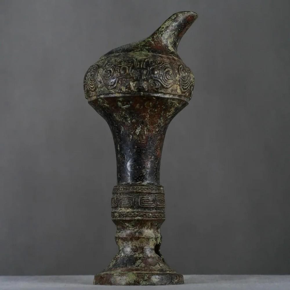 Antique Bronze Flower Goblet Statue: Antique Bronze Flower Goblet Statue This rare Chinese antique features a finely crafted bronze goblet, adorned with intricate flower designs that symbolize beauty, renewal, and abundance. The meticulo