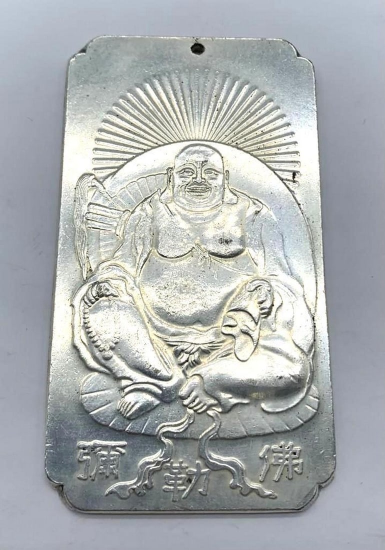 Tibetan Silver Bar Featuring the Chinese Monk Budai: Tibetan Silver Bar Featuring the Chinese Monk Budai. Weighing 135g. This exquisite Tibetan silver bar features a beautifully detailed depiction of Budai, the jovial Chinese monk often associated with