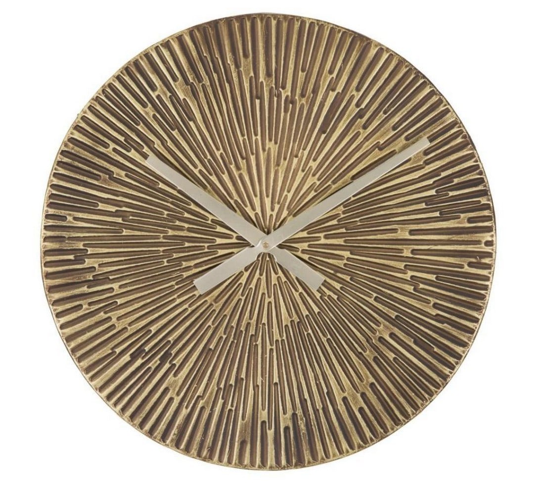 Bronze Metal Wall Clock: Bronze Metal Wall Clock Elevate your space with this bronzed metal wall clock, showcasing a sleek and minimalist design that effortlessly blends function with style. With its refined finish and timele