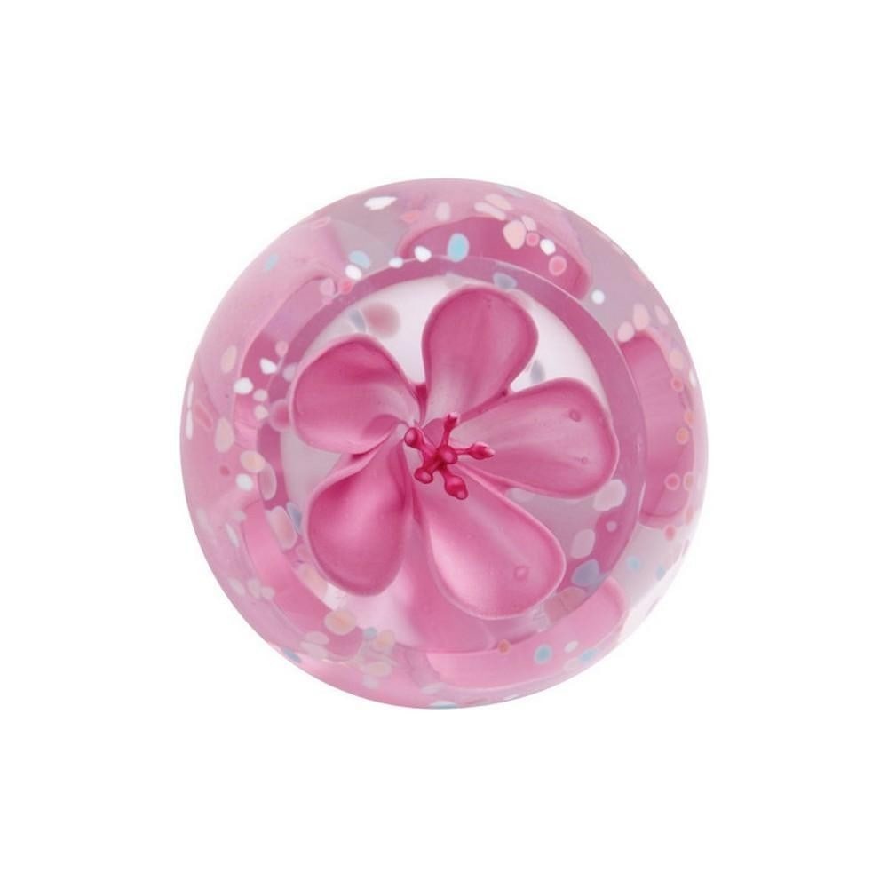 Blush Rose Blossom Paperweight: Blush Rose Blossom Paperweight A handcrafted glass paperweight featuring delicate rose blossoms floating within a blush-colored dome, accented with soft pastel flecks. Created using the millefiori tec