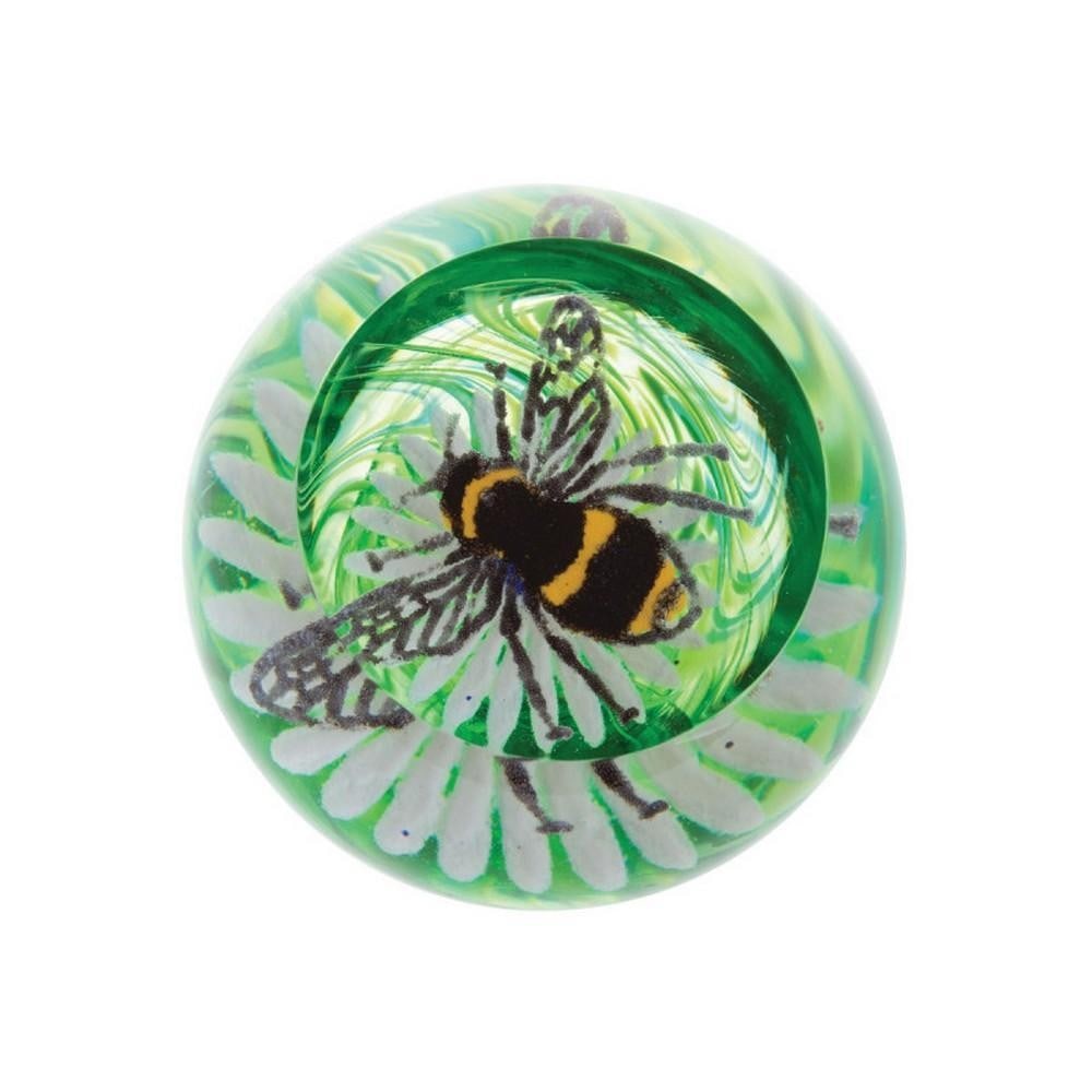 Buzzing Bee Paperweight: Buzzing Bee Paperweight A handcrafted glass paperweight featuring a detailed bee perched on a flower, set against rich green tones reminiscent of a summer garden. A charming and whimsical decorative a