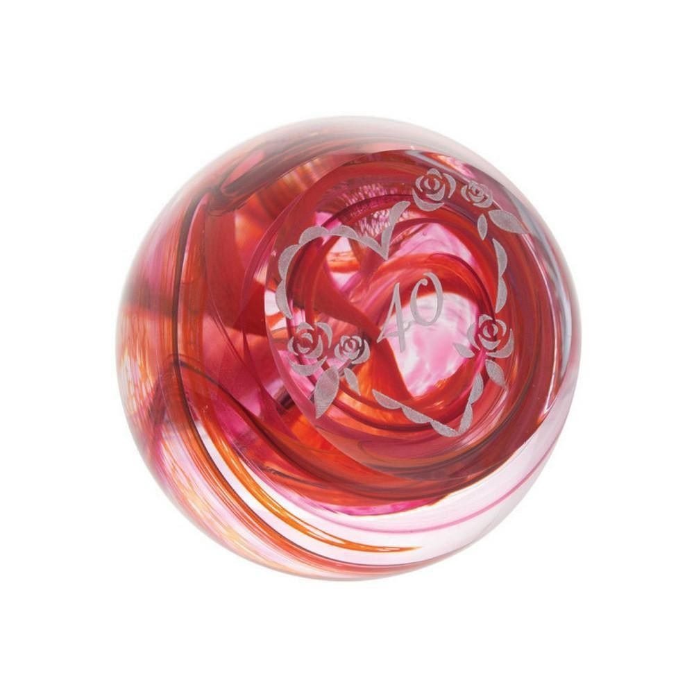 Ruby 40th Anniversary Paperweight: Ruby 40th Anniversary Paperweight A handcrafted glass paperweight celebrating a 40th milestone. Swirling deep red glass evokes passion and devotion, with a delicate heart emblem at its center. A thoug
