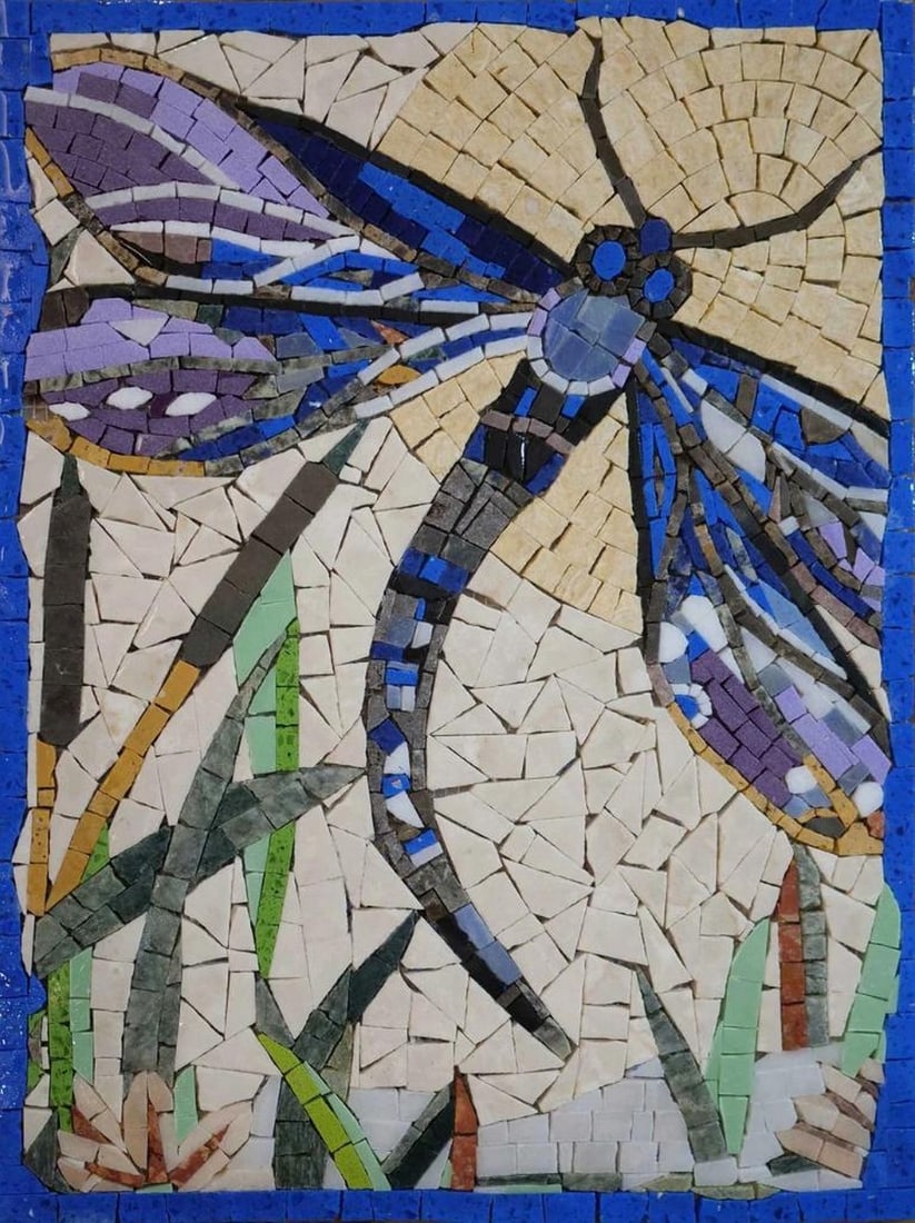 Blue Dragonfly Mosaic: Blue Dragonfly Mosaic A handcrafted mosaic design made from natural stone. The piece features a blue dragonfly motif created by carefully cutting and arranging individual stone tiles, resulting in a d