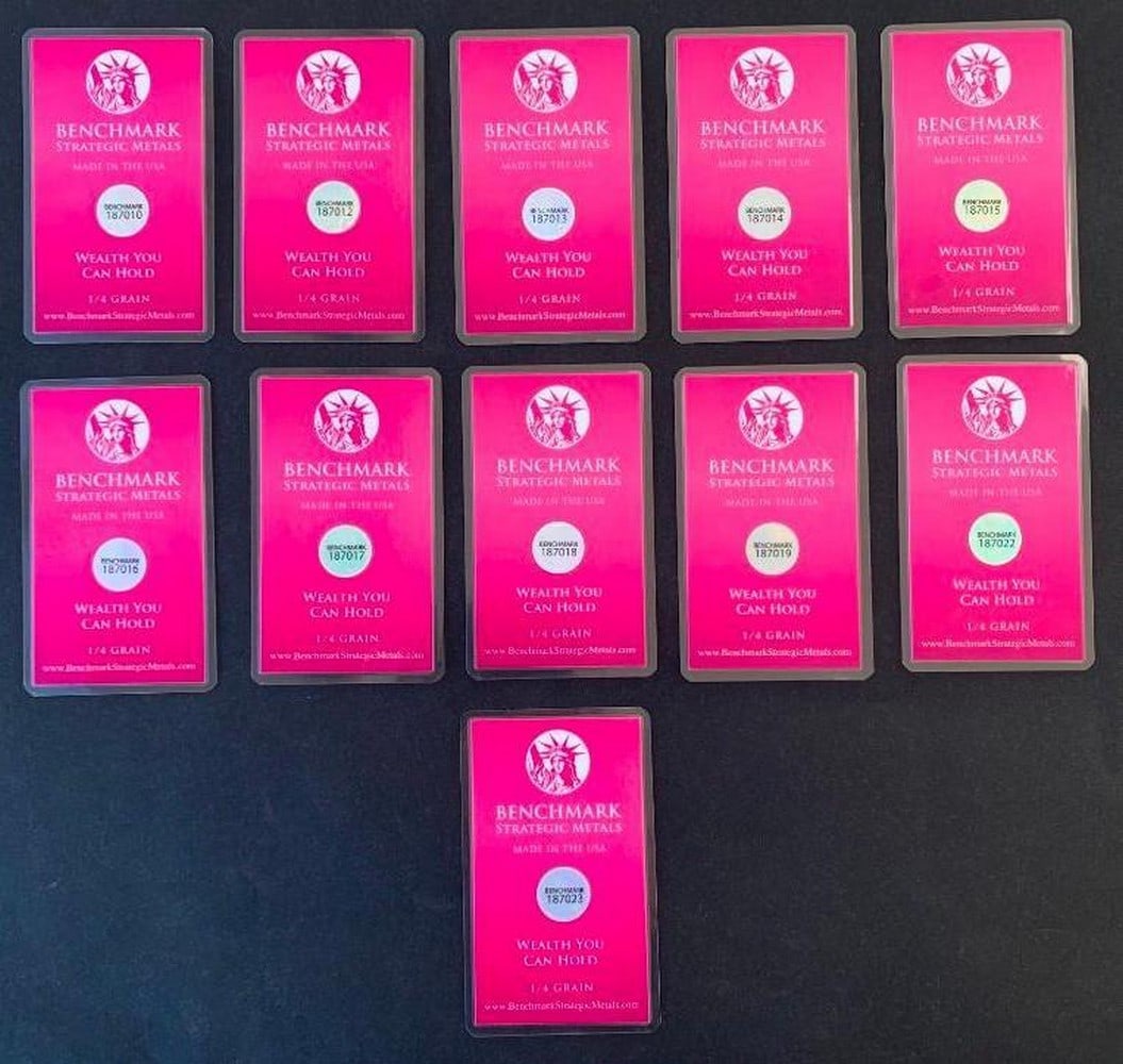 Lot of Eleven Benchmark 1/4 Grain .999 Fine Gold Bars in COA Cards: Lot of Eleven Benchmark 1/4 Grain .999 Fine Gold Bars in COA Cards This is a set of eleven Benchmark Certificate of Authenticity cards, each containing an encapsulated 1/4 grain .999 fine gold bar. Th