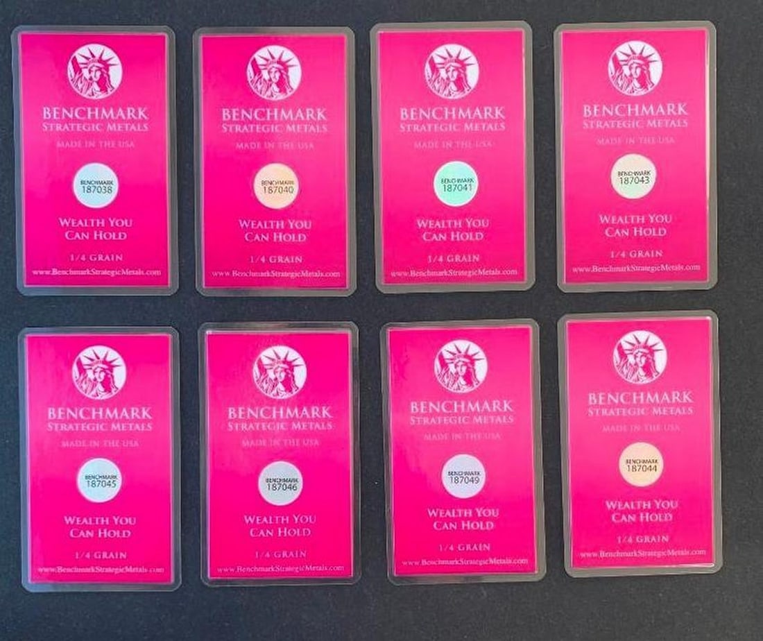Lot of Eight Benchmark 1/4 Grain .999 Fine Gold Bars in COA Cards: Lot of Eight Benchmark 1/4 Grain .999 Fine Gold Bars in COA Cards This is a set of eight Benchmark Certificate of Authenticity cards, each containing an encapsulated 1/4 grain .999 fine gold bar. Thes