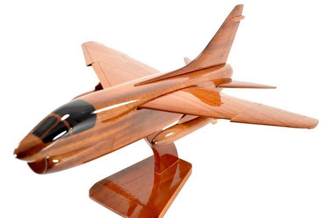 A-7 Corsair Wooden Model: A-7 Corsair Wooden Model This meticulously crafted mahogany wooden model of the A-7 Corsair captures the iconic design of the renowned attack aircraft. Expertly carved from high-quality mahogany, the