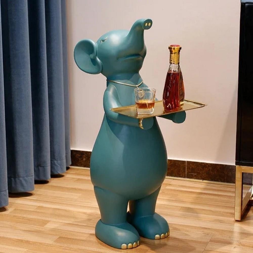 Butler Elephant Tray Table Sculpture: Butler Elephant Tray Table Sculpture Introducing the Butler Elephant Tray Table Sculpture, a stunning blend of functionality and artistry. Crafted with exquisite detail, this piece features a majestic