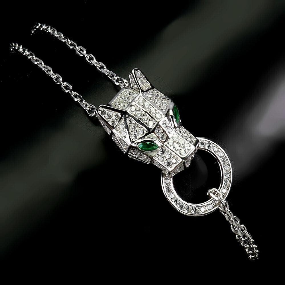 Green Eyes White Cz 925 Sterling Silver Tiger Bracelet: Green Eyes White Cz 925 Sterling Silver Tiger Bracelet Metal: 925 Sterling Silver Style: Tennis Plate: 14k White Gold Stone Colour: AAA Green Chain Type: Curb Link Length: 7" View Photos For