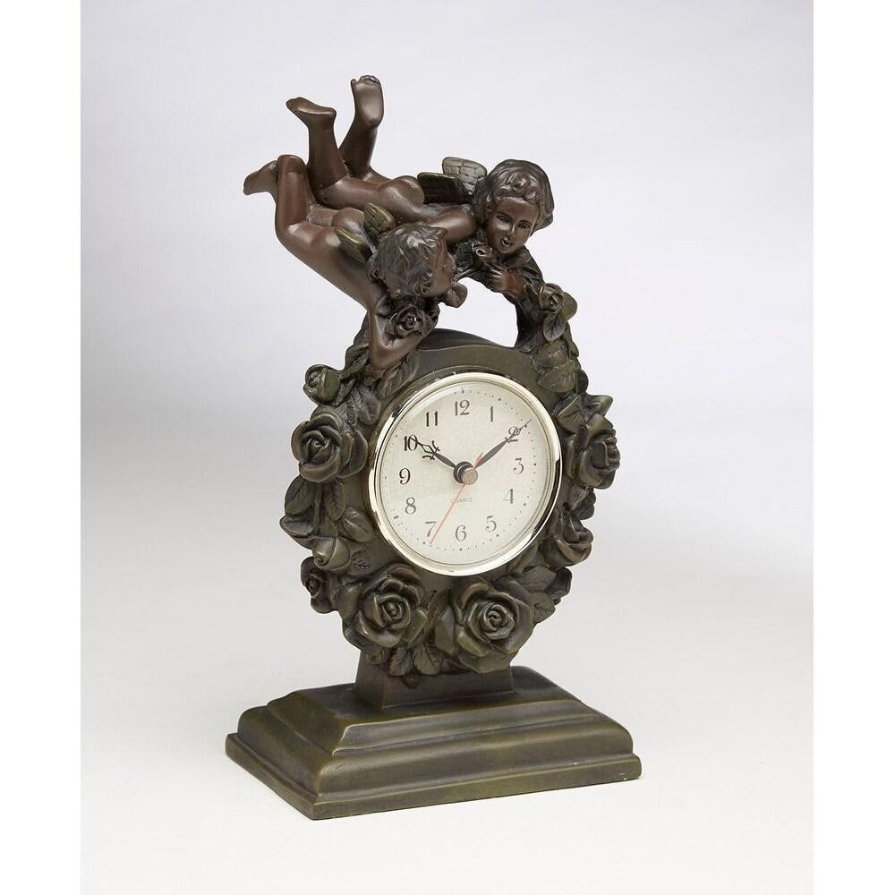 Resin Cherub Table Clock: Resin Cherub Table Clock Complete the look of your console tables or shelves with this resin table clock. Inspired by classic and antique sculptures, it features a standard clock flanked by cherubs. C