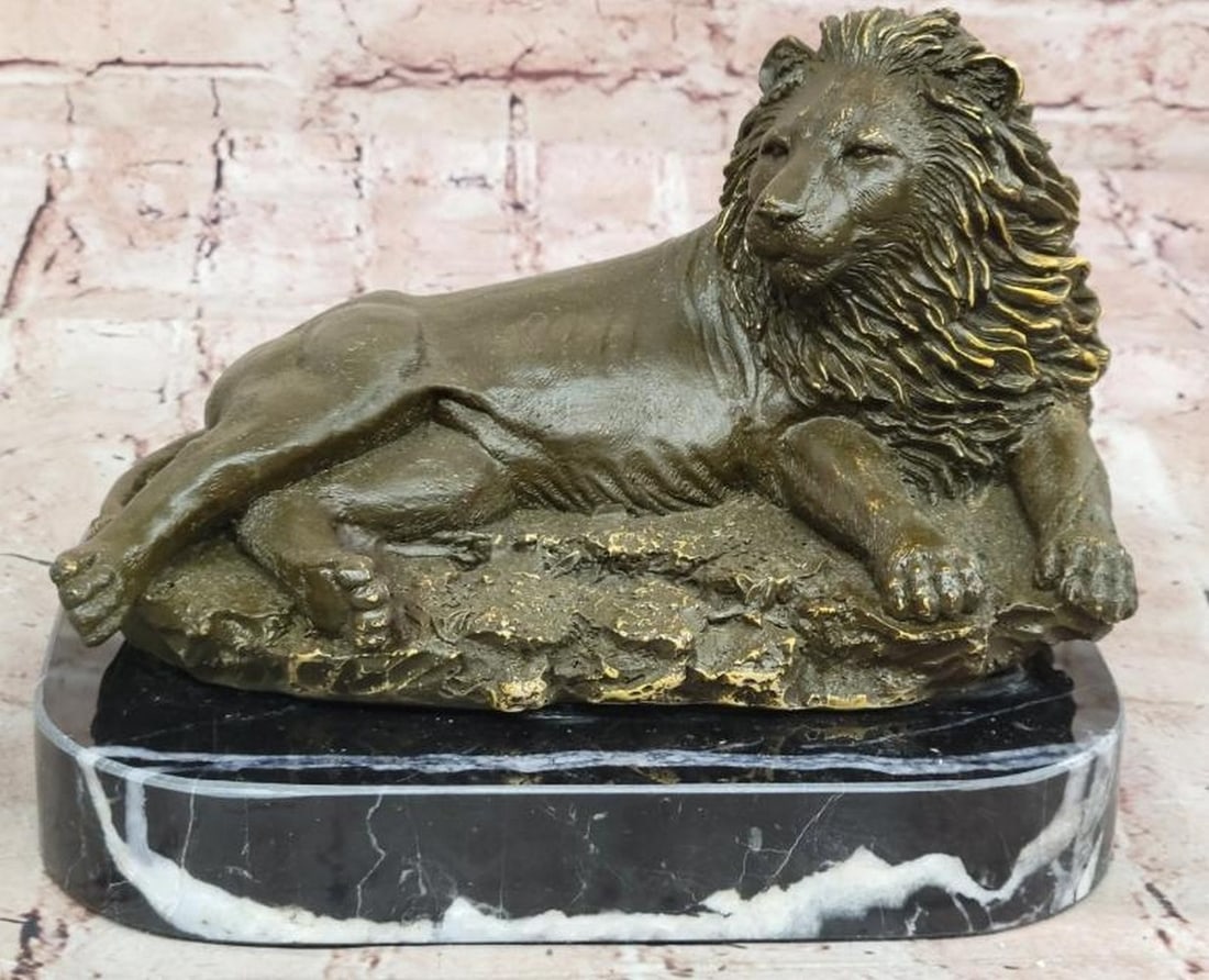 Lion at Ease: Bronze Sculpture of a Resting King: Lion at Ease: Bronze Sculpture of a Resting King Graceful yet commanding, this bronze sculpture, inspired by and bearing the signature of the renowned French artist Antoine-Louis Barye, depicts a lio