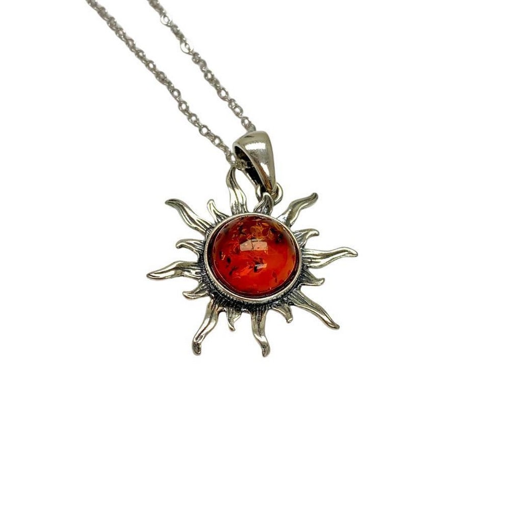 Bright Amber Sun Pendant Necklace: Bright Amber Sun Pendant Necklace. Shine With A Radiance That Only Glows When You Wear This Beautiful Amber Sun Pendant Necklace. This Pendant Is Beautifully Crafted With Vivid Color That Will Give