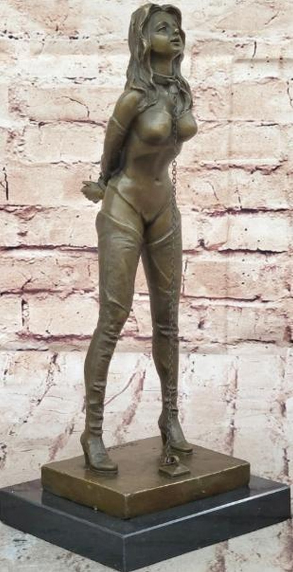Erotic Bondage Female Bronze Sculpture: Erotic Bondage Female Bronze Sculpture Bold, provocative, and meticulously crafted, this is a reproduction bronze sculpture that explores themes of submission and control through refined artistry. The