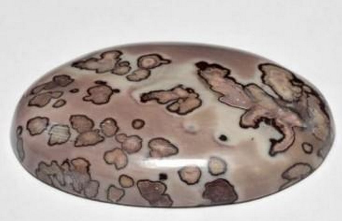 44.25ct Earthscape Oval Jasper Gemstone: 44.25ct Earthscape Oval Jasper Gemstone This striking 44.25 ct multicolor jasper gemstone features a richly patterned surface in earthy pinks, mossy browns, and golden ochres. Expertly cut in a smoot