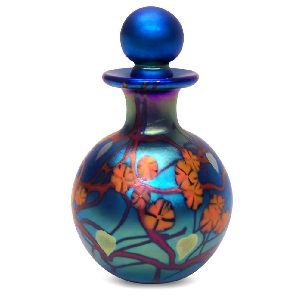 "California Poppy" Blue Round Glass Perfume Bottle by Carl Radke: "California Poppy" Blue Round Glass Perfume Bottle by Carl Radke Crafted with meticulous care and a generous amount of pure silver, these Blue California Poppy Round Glass Perfume Bottles are