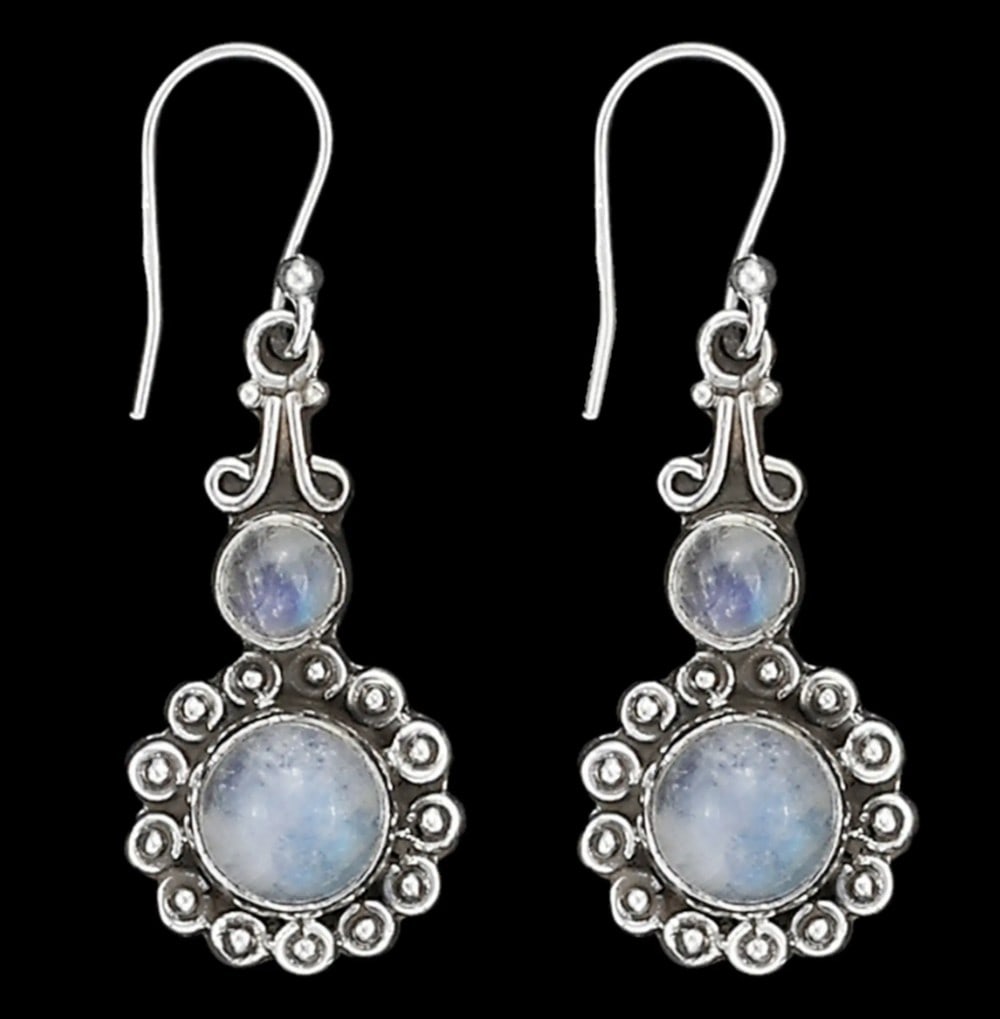 Celestial Grace Silver Earrings: Celestial Grace Silver Earrings Enhance your look with these elegant sterling silver earrings featuring mesmerizing rainbow moonstones. Their sleek design, paired with the moonstones’ enchanting pl