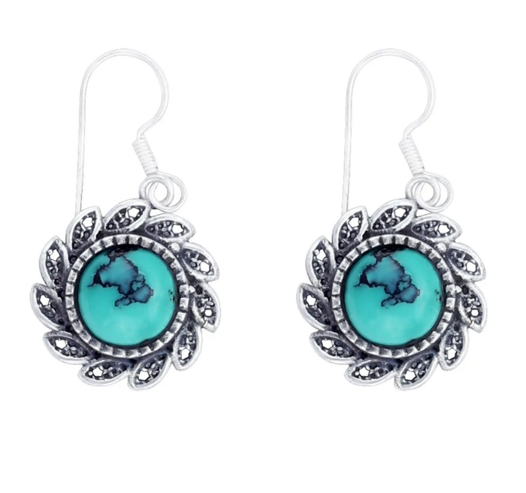 Radiant Horizon Turquoise Earrings: Radiant Horizon Turquoise Earrings These charming dangle earrings feature round turquoise stones accented with delicate heart embellishments, adding a playful and whimsical touch. The vibrant