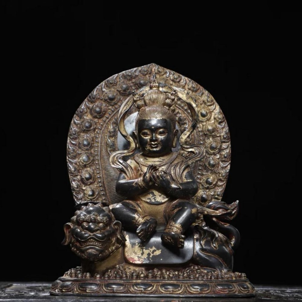 Chinese Antique Manjusri Bodhisattva Riding a Beast Bronze Statue: Chinese Antique Manjusri Bodhisattva Riding a Beast Bronze Statue This exquisite and rare handmade Chinese statue depicts Manjusri Bodhisattva, the embodiment of wisdom, seated majestically upon a sac