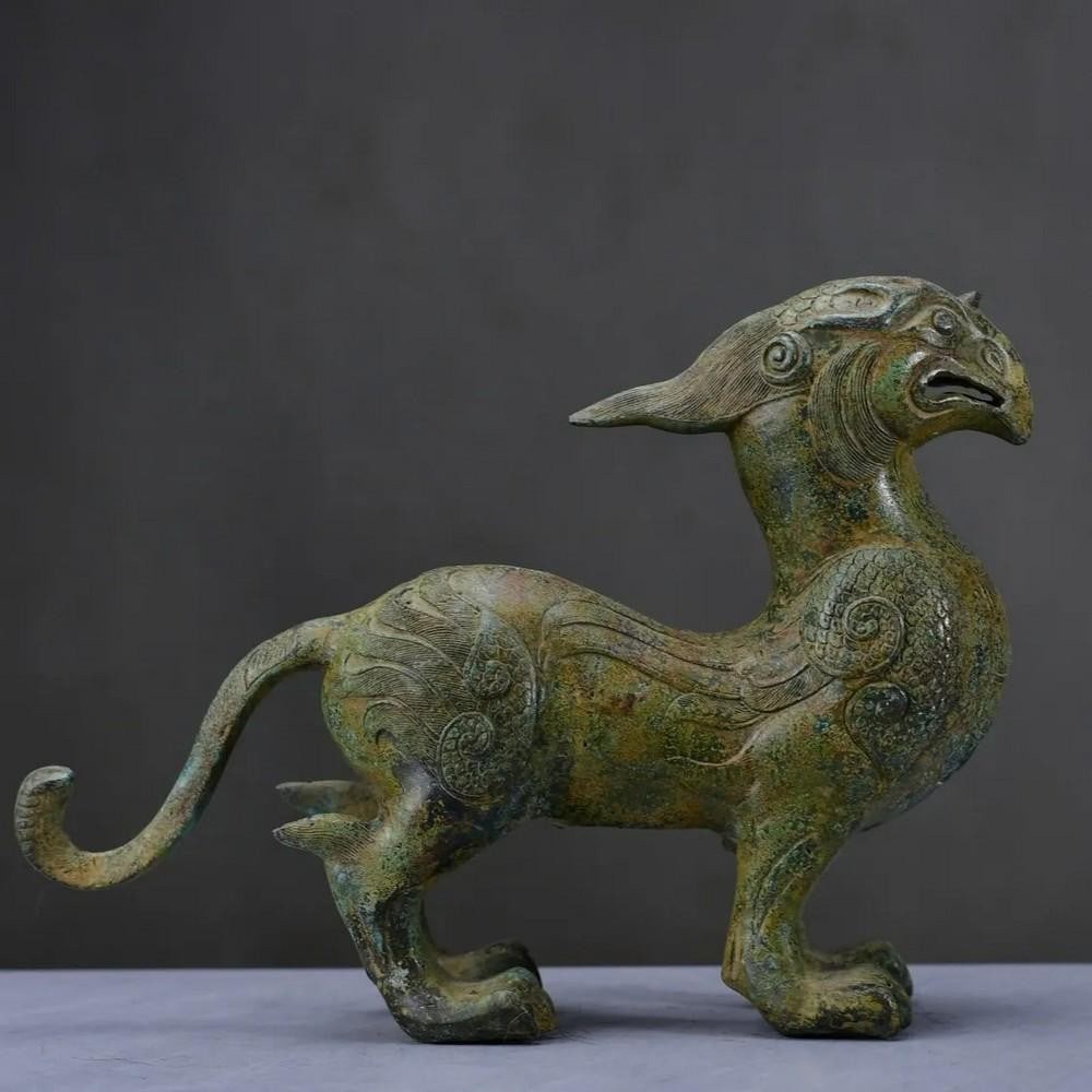 Exquisite Handcrafted Bronze Qilin (Chinese Unicorn) Statue – Chinese Antique Ornament: Exquisite Handcrafted Bronze Qilin (Chinese Unicorn) Statue – Chinese Antique Ornament This stunning antique bronze statue depicts a Qilin, often referred to as the "Chinese unicorn," a myt