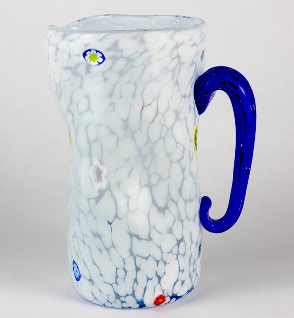 Monochrome White Pitcher – Murano Glass: Monochrome White Pitcher – Murano Glass This carafe is crafted using glassblowing techniques, featuring murrina decorations and macete—small pieces of glass that add vibrant colors. It’s perfec