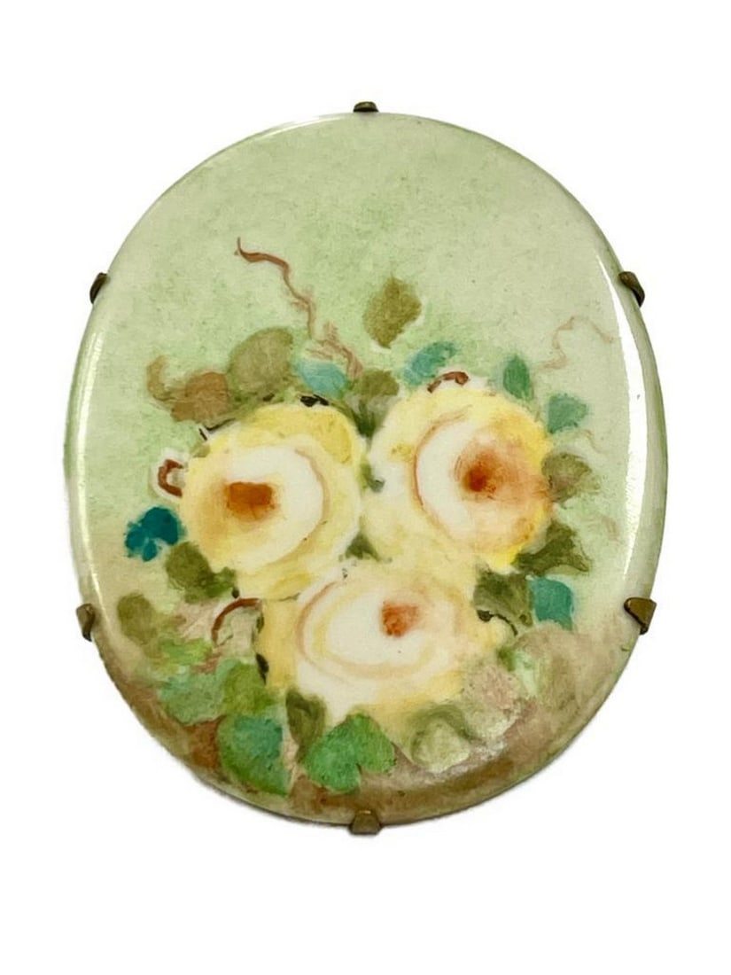 Vintage Porcelain Hand-Painted Floral Elegance Brooch: Vintage Porcelain Hand-Painted Floral Elegance Brooch Transport yourself to a bygone era of timeless sophistication with our Vintage Porcelain Hand-Painted Floral Elegance Brooch. This exquisite