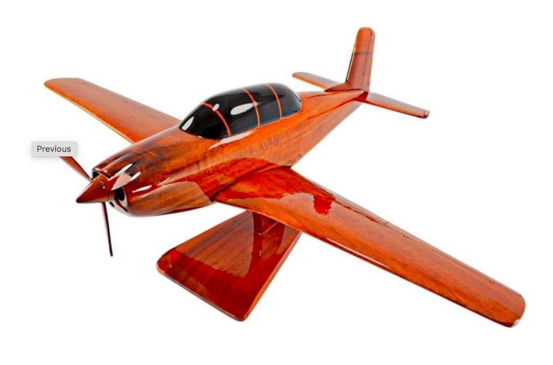 T-34 Mentor Model Plane: T-34 Mentor Model Plane The T-24 Mentor is an American propellor-driven, single-engined, military trainer aircraft. This handcrafted replica has moveable props and hand carved details, it is made of