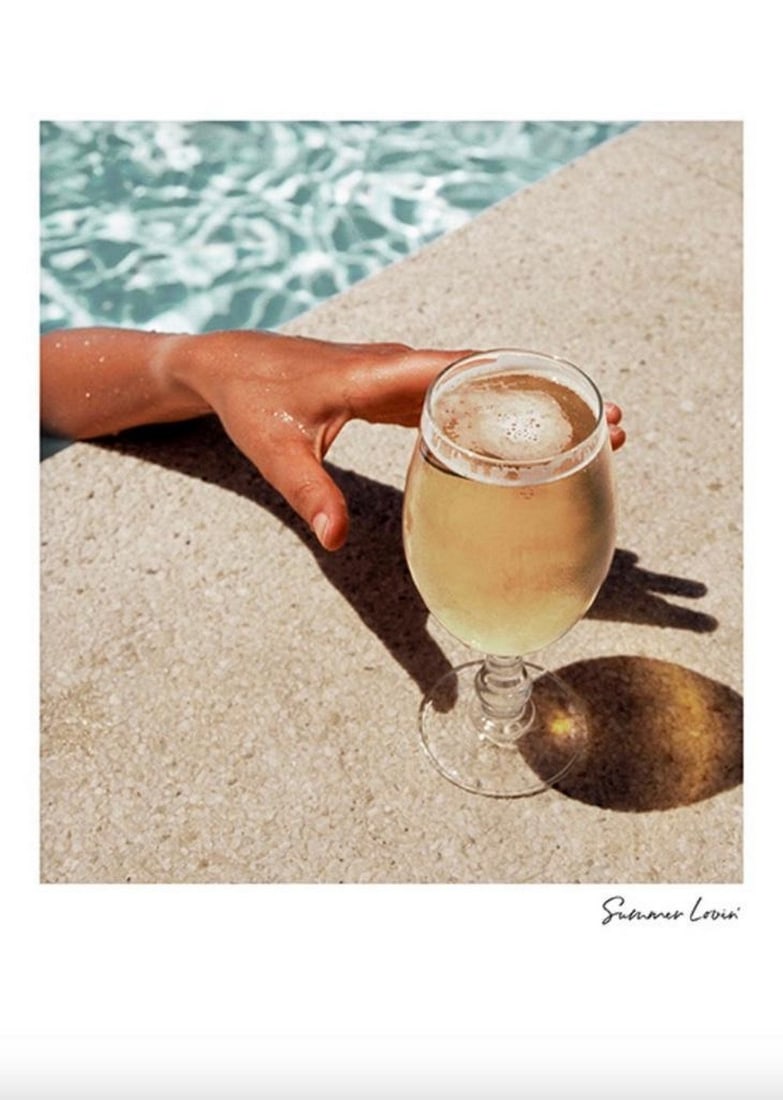 Summer Loving' By The Pool Poster: Summer Loving' By The Pool Poster Hand and drink. Photograph of a hand reaching out towards a drink from a pool. Get in that summery spirit with photo art featuring the top things about this sunn
