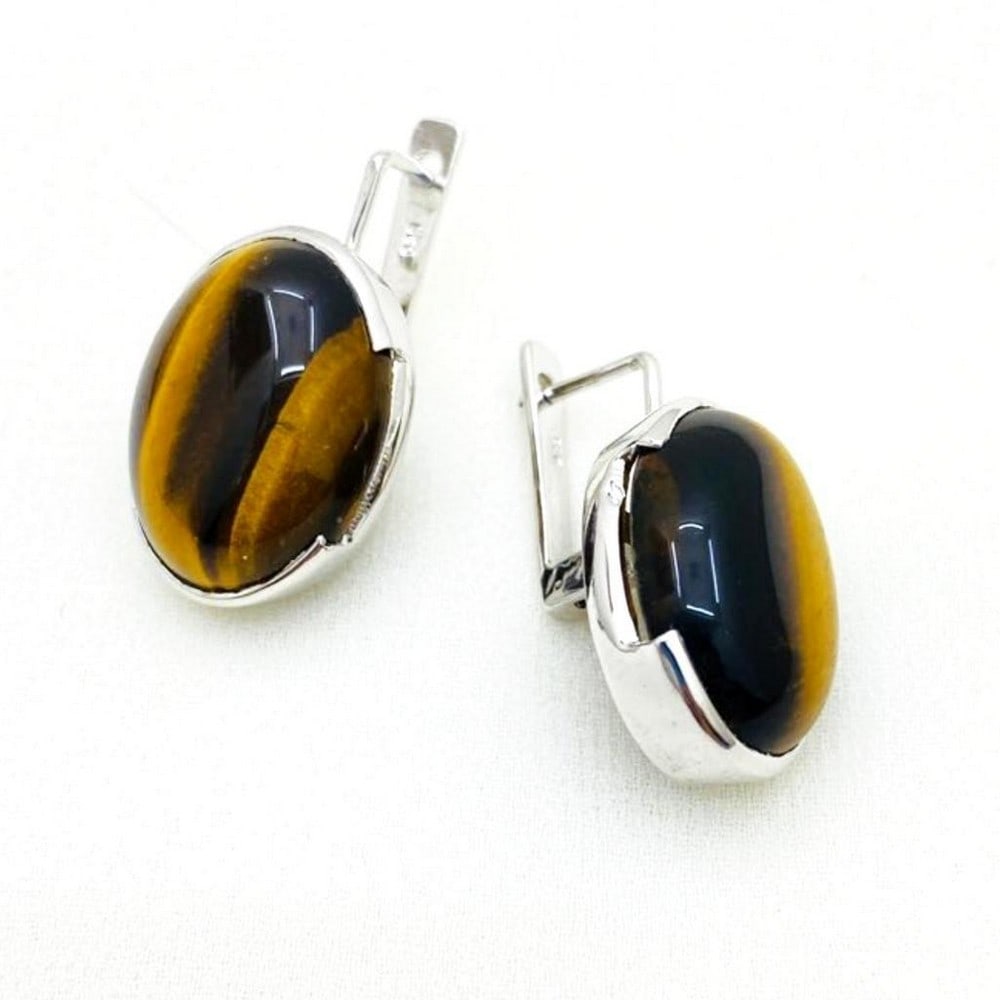Tiger's Eye Cabochon Latch Back Earrings: Tiger's Eye Cabochon Latch Back Earrings These latch back earrings are 925 Sterling Silver featuring beautiful brown tiger's eye gemstones. View Photos For Further Details.