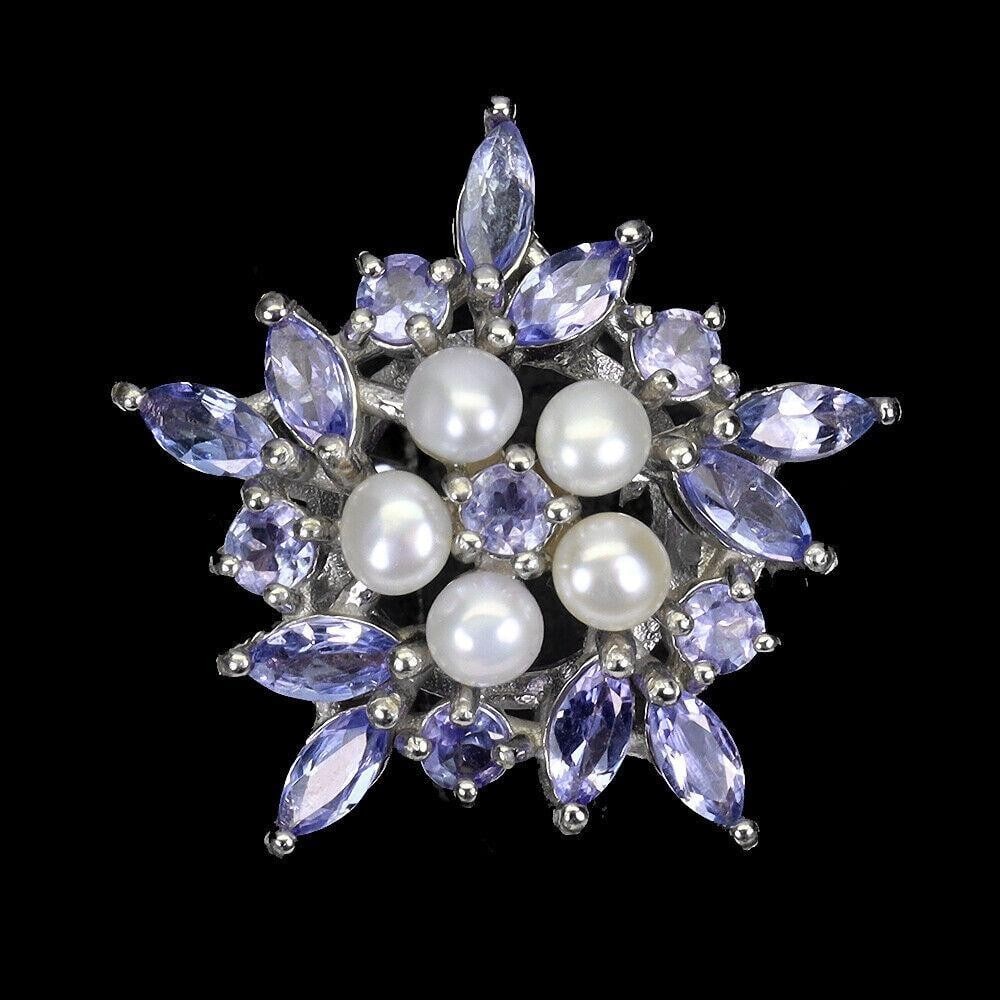 Marquise Cut Tanzanite 5x2.5mm Sterling Silver Ring With 4 Pearl & Round Cut Center Stone - Size 7.5: Marquise Cut Tanzanite 5x2.5mm Sterling Silver Ring With 4 Pearl & Round Cut Center Stone - Size 7.5 TYPE OF METAL: 925 STERLING SILVER PLATE: 14K WHITE GOLD RING SIZE: 7.5 MAIN STONE: