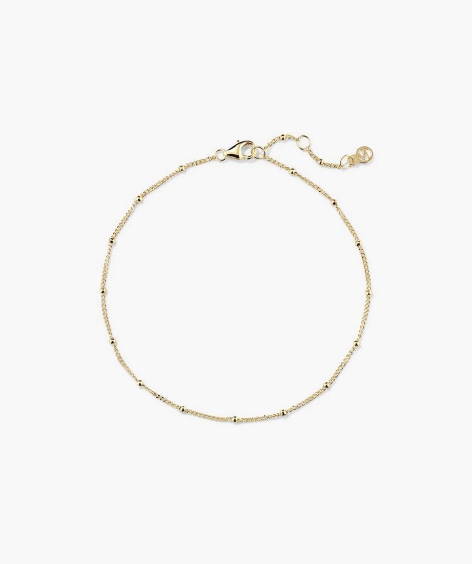 14k Yellow Gold Minimalist Sphere Chain: 14k Yellow Gold Minimalist Sphere Chain A slender 14k yellow gold chain featuring small hollow spheres for a refined, understated look. Lightweight and versatile, it can be worn alone for
