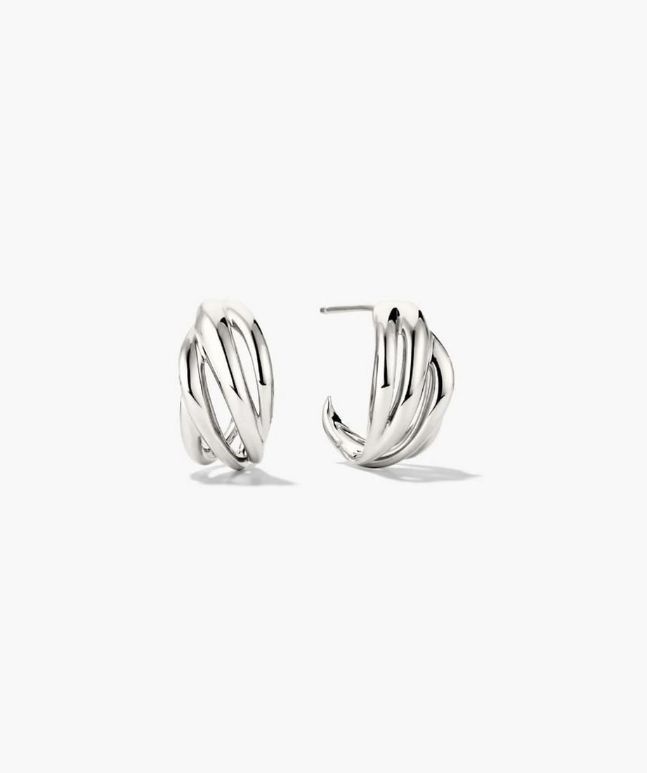 Textured Sterling Silver Asymmetrical Hoops: Textured Sterling Silver Asymmetrical Hoops Minimalism with a twist. These textured sterling silver hoops feature open spaces and an asymmetrical design, offering a fresh, modern take on everyday