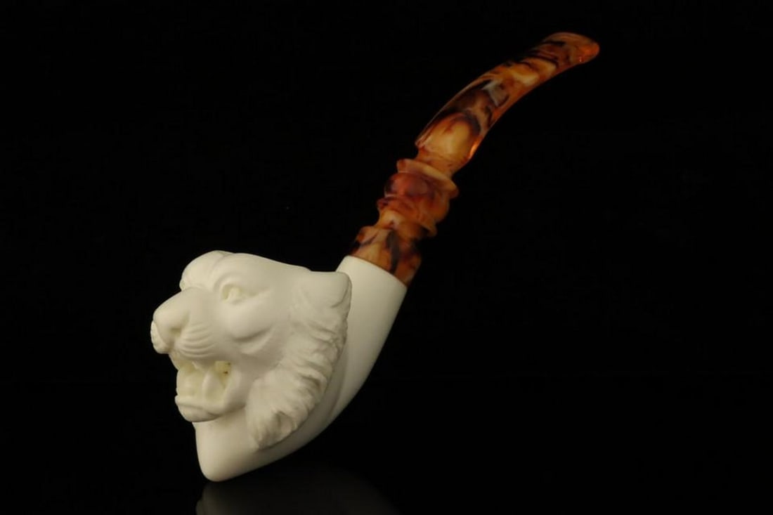 Tiger Carved Block Meerschaum Pipe with Fitted Case: Tiger Carved Block Meerschaum Pipe with Fitted Case This hand-carved block meerschaum pipe features a striking tiger design, showcasing the skill and artistry of traditional meerschaum craftsmanship.