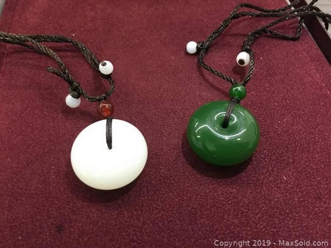 Pair Of White & Green Jade Carved Pendants: One Green Jade Carved Pendant and A White Jade Carved Pendant. Lot Is For Both Asian Carved Pieces. View Photos For Further Details.