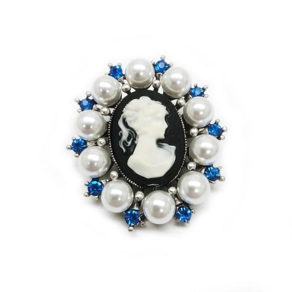 Blue Rhinestone And White Pearl Cameo Broach: Blue Rhinestone And White Pearl Cameo Brooch This exquisite cameo brooch features a delicate silhouette of a woman, framed by shimmering blue rhinestones and pearls. Perfect for adding a touch of
