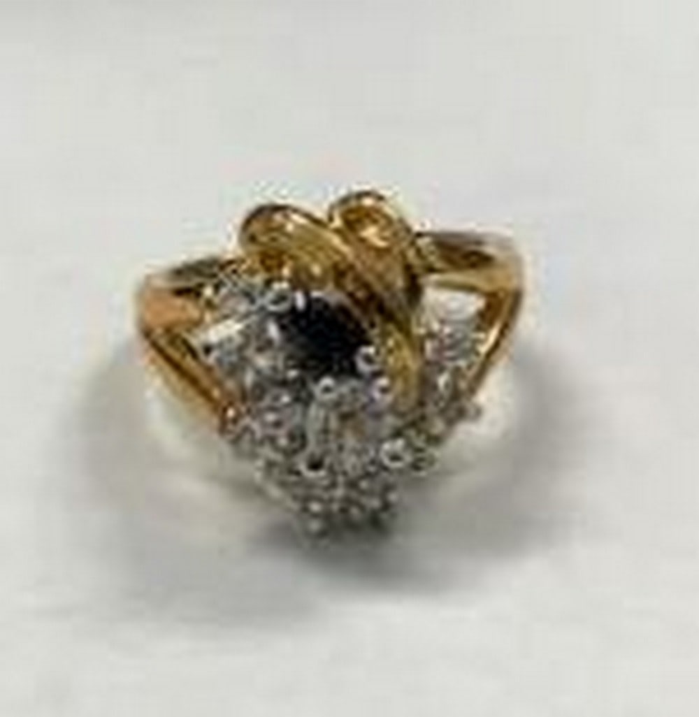 Gold Electroplated Ring with Clear and Black Gemstones: Gold Electroplated Ring with Clear and Black Gemstones Make a sophisticated statement with this stunning gold electroplated cluster ring, beautifully designed with a sparkling arrangement of clear