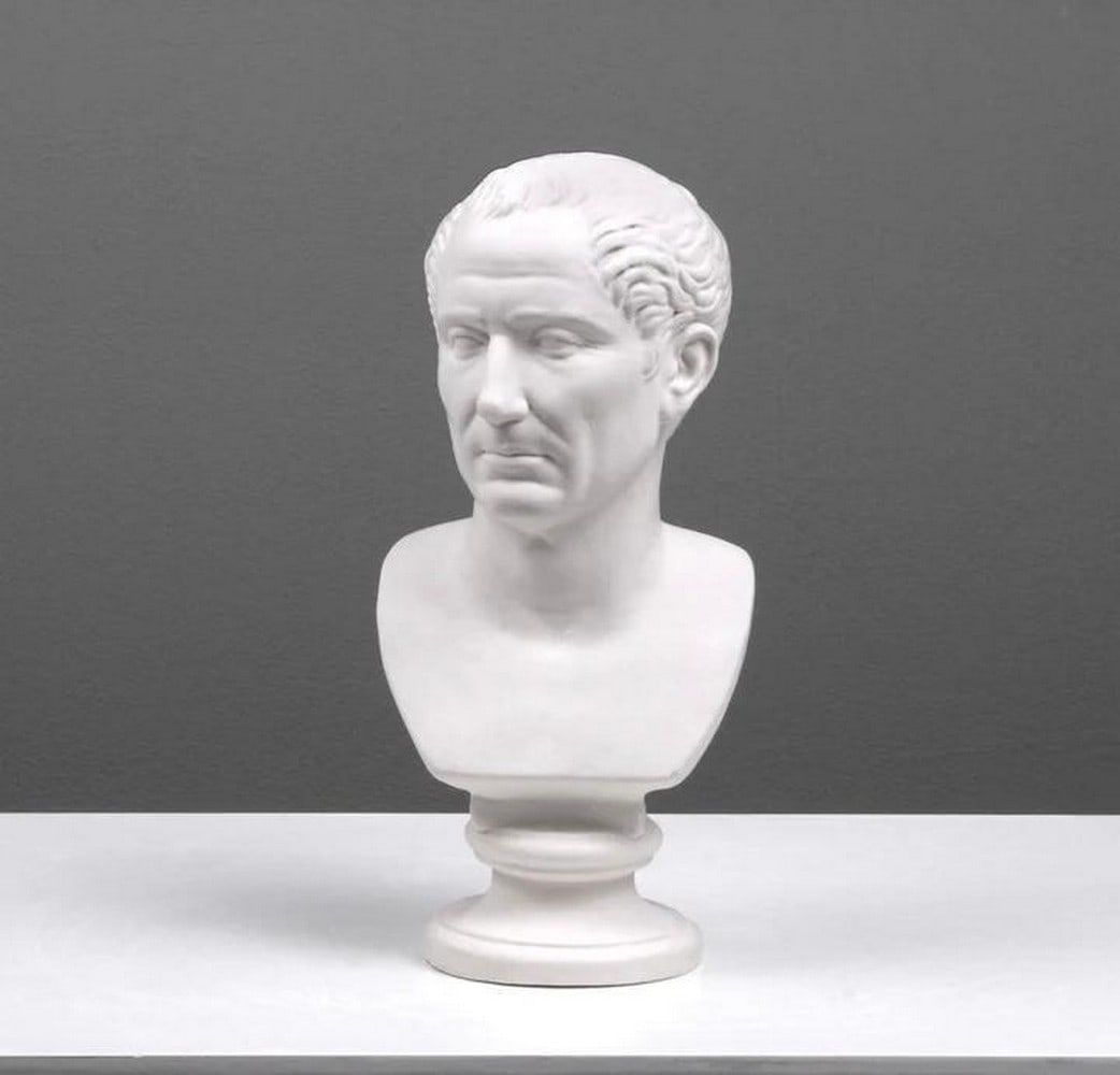Imperial Command: Julius Caesar Bust Sculpture: Imperial Command: Julius Caesar Bust Sculpture This striking marble bust of Julius Caesar captures the formidable presence of one of history's most iconic leaders. Skillfully crafted, the sculptu