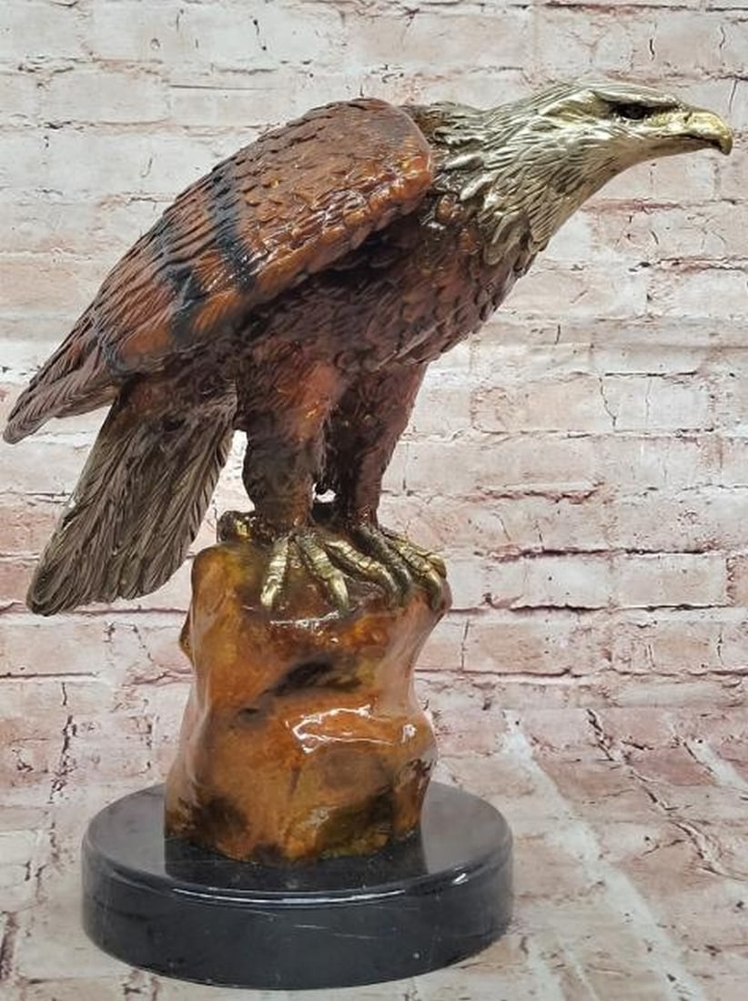 Eagle on Tree Trunk Reproduction Bronze Sculpture: Eagle on Tree Trunk Reproduction Bronze Sculpture A stunning display of strength and elegance, this reproduction bronze sculpture features a proud eagle perched atop a rugged tree trunk-style base, e