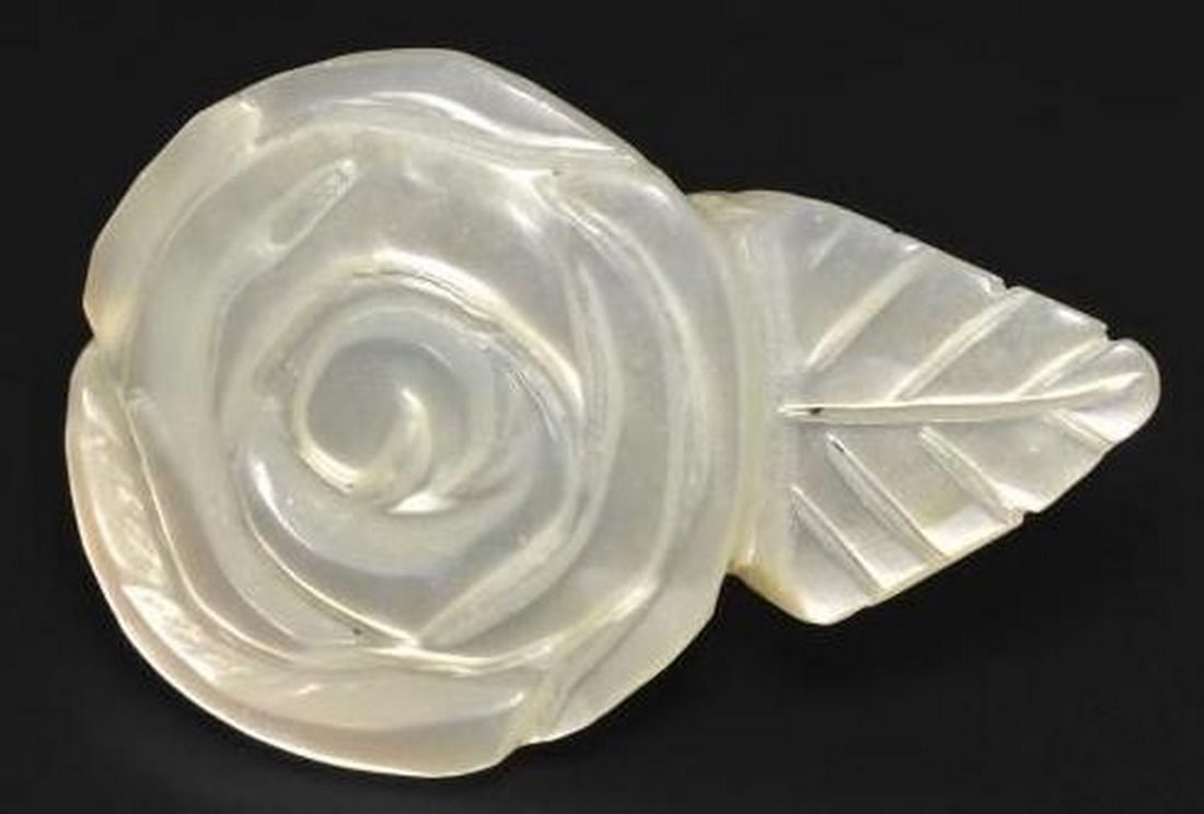 Pearl White Mother of Pearl Rose Carved Gemstone: Pearl White Mother of Pearl Rose Carved Gemstone Gracefully carved into the shape of a blooming rose, this loose gemstone is crafted from lustrous Mother of Pearl in a soft pearl white hue. The