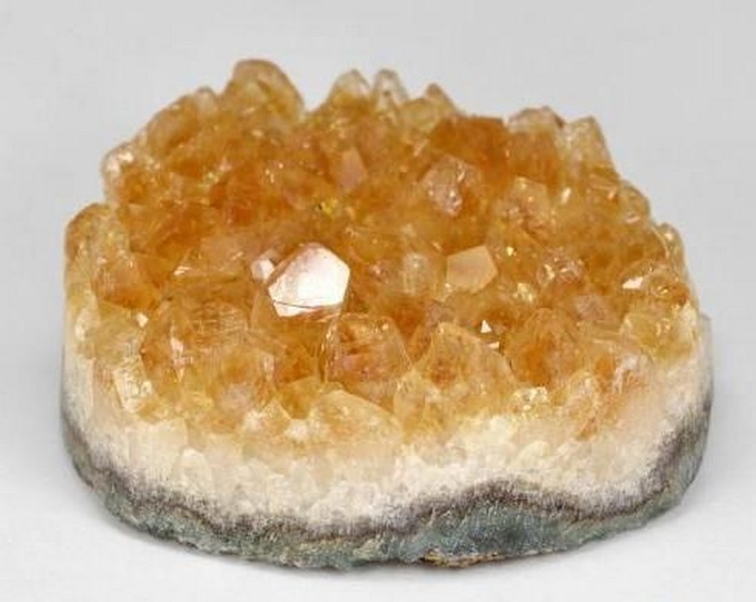 Radiant Honey Orange Druzy Citrine: Radiant Honey Orange Druzy Citrine Bursting with golden warmth, this striking Druzy Citrine features a fancy-shaped crystal cluster that glows in rich honey orange hues. A natural formation of sparkl