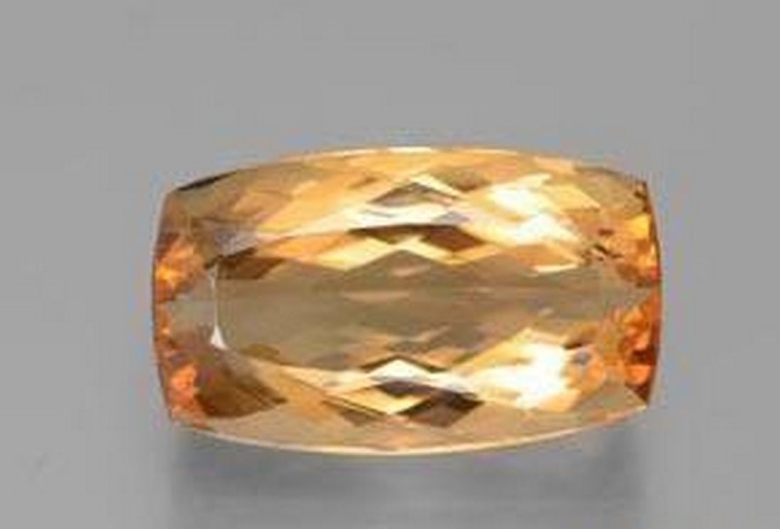 6.29ct Cushion Cut Imperial Orange Topaz: 6.29ct Cushion Cut Imperial Orange Topaz A vivid, intense orange topaz with a cushion cut and VVS clarity, untreated to highlight its natural brilliance. Believed to boost confidence, creativity, an