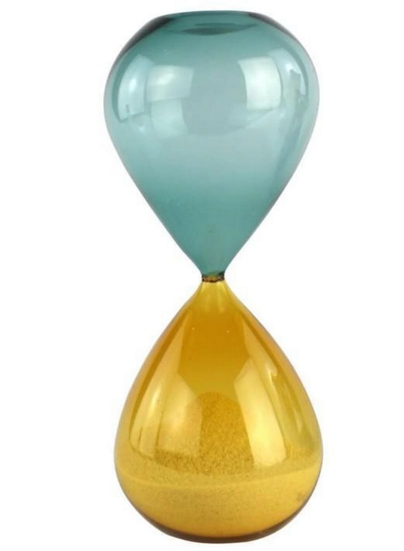 Time Will Tell Hourglass Sculpture: Time Will Tell Hourglass Sculpture A timeless symbol of balance and reflection, this Murano glass hourglass features a sleek silhouette in radiant yellow and blue tones. Hand-blown by skilled