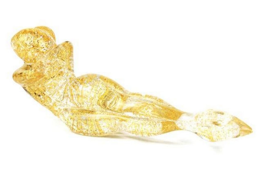Golden Embrace: Golden Embrace A tender portrayal of intimacy, Lying Lovers in Gold captures a moment of serene connection between two reclining figures. Hand-sculpted in Murano glass, the piece glows with soft
