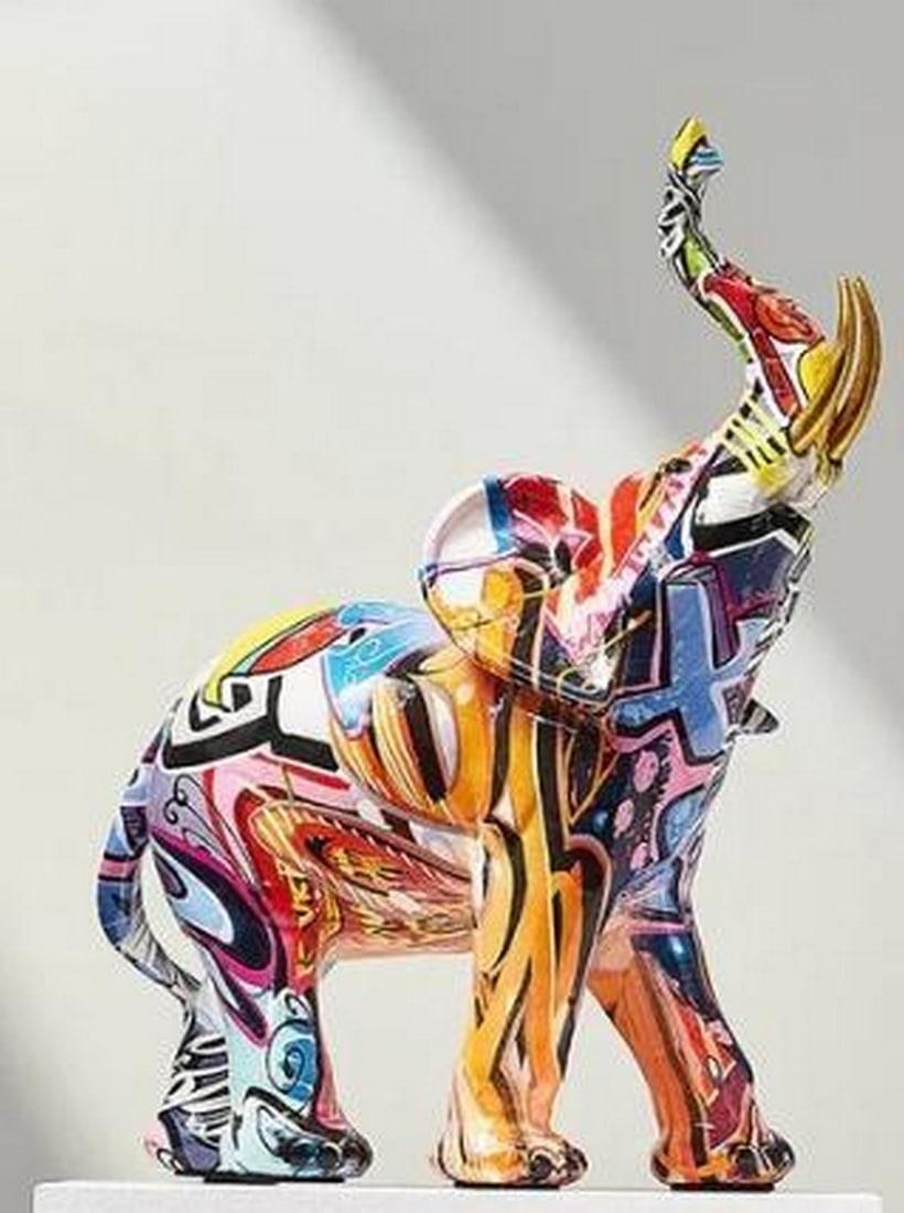 Graffiti Elephant Resin Sculpture: Graffiti Elephant Resin Sculpture Majestic and bold, this resin elephant sculpture commands attention with its fusion of tradition and street-inspired design. Its powerful form is wrapped in a vivid