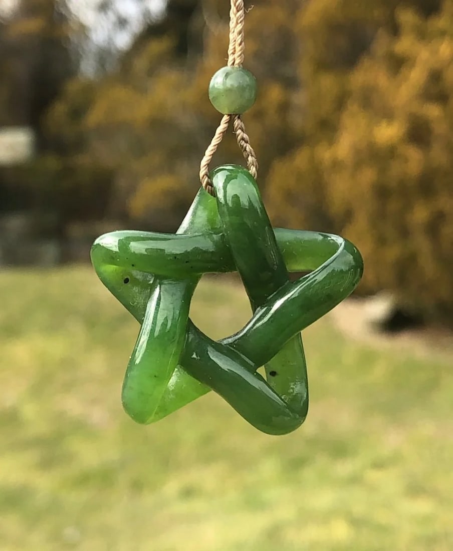 Canadian Nephrite Jade Star Pendant: Canadian Nephrite Jade Star Pendant This pendant is crafted from genuine Canadian Nephrite Jade and shaped into a refined star design, symbolizing guidance and protection. The polished finish enhance