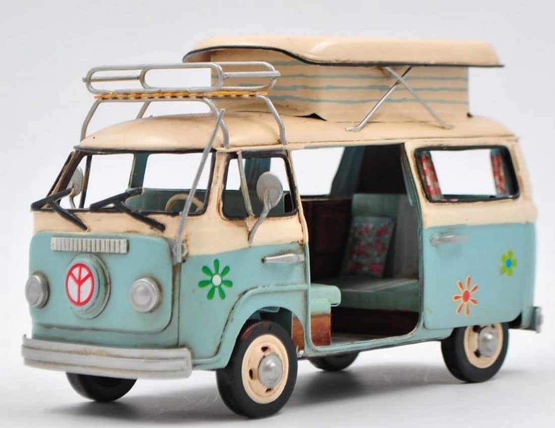 Retro Surf Bus: Retro Surf Bus This large-scale tin plate bus brings the spirit of the '60s to life with its playful two-tone blue and cream design and groovy details. Adorned with colorful flower stickers along