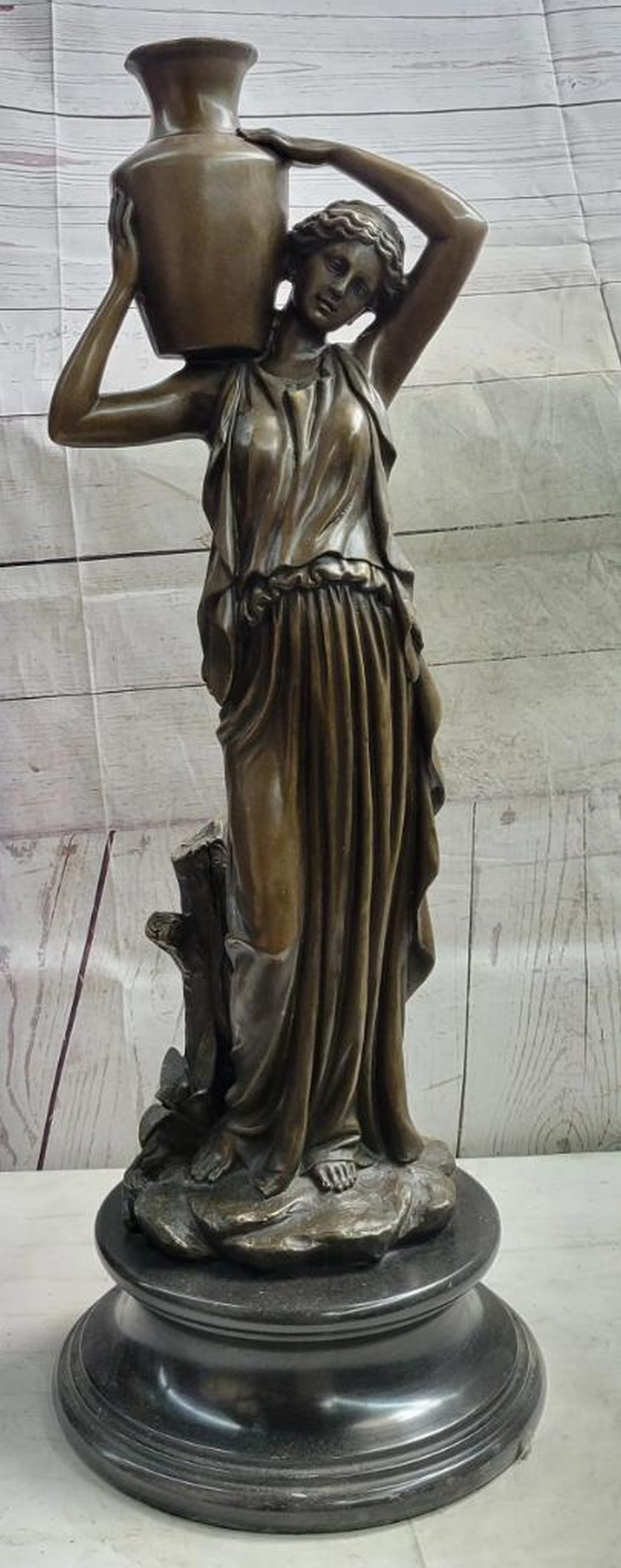 Bronze Victorian Woman in Contemplation Sculpture by Jean Patoue - 28" x 9": Bronze Victorian Woman in Contemplation Sculpture by Jean Patoue - 28" x 9" This captivating bronze sculpture by Jean Patoue portrays a Victorian woman in a moment of deep reflection, cradling